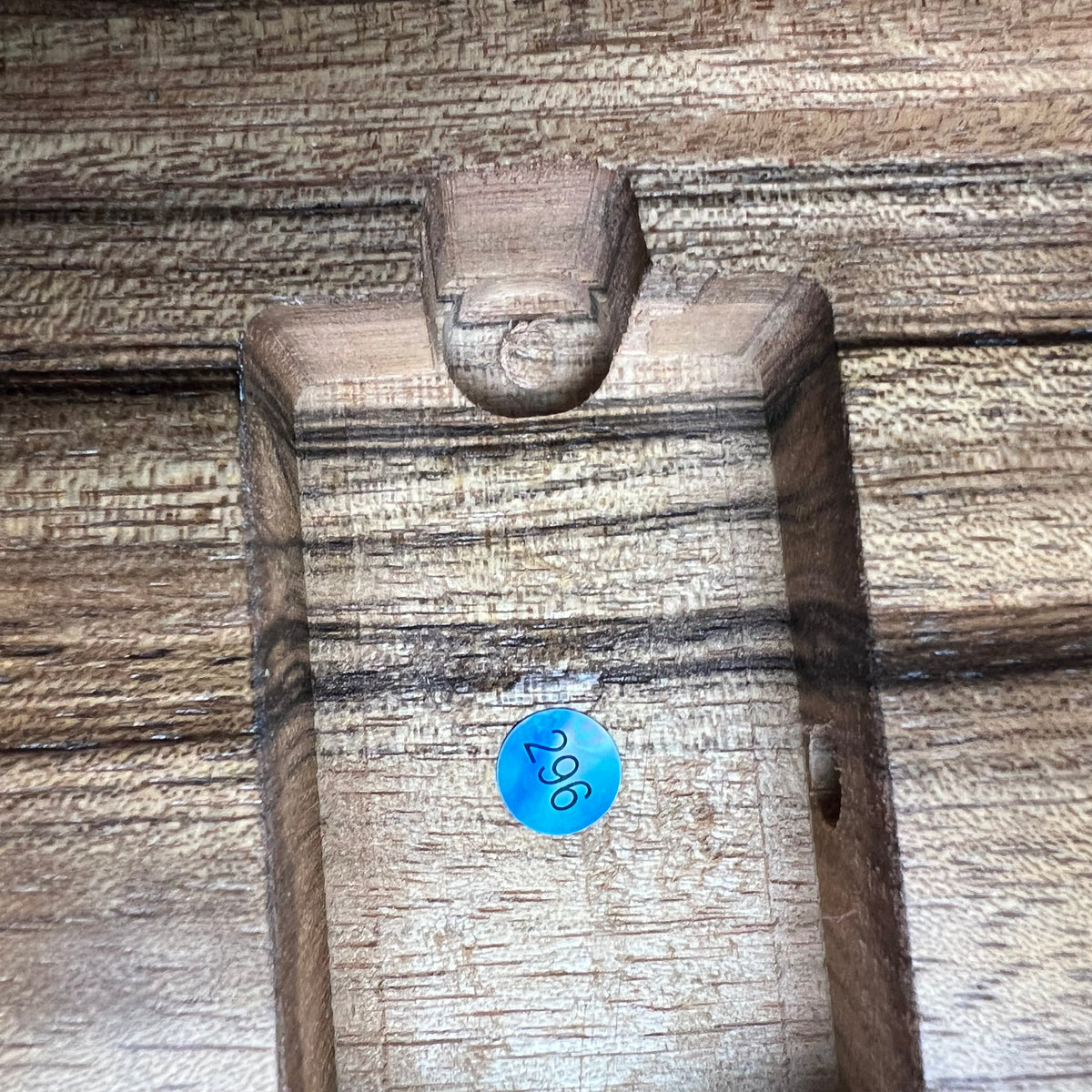 Strat-style guitar body with carved pickup rout and blue inspection mark