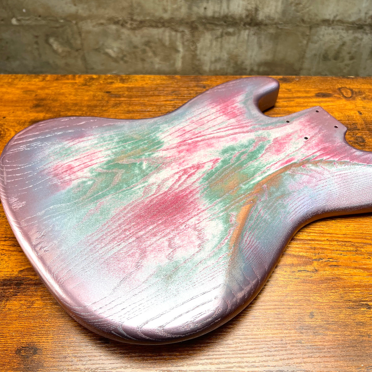 Replacement J Bass body, silvery pink-and-green relic finish, smooth curved top