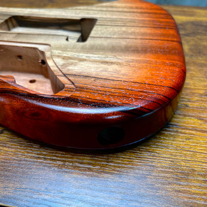 Strat-style guitar body back end with bridge mounting hole and curved contour