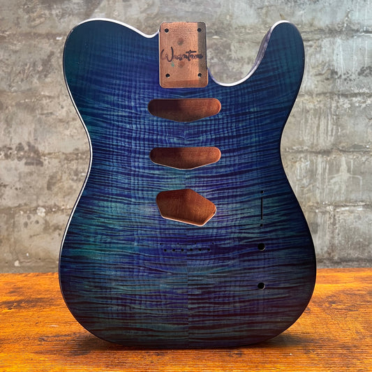 Blue flamed maple Telecaster-style guitar body front with neck plate and carved cutouts